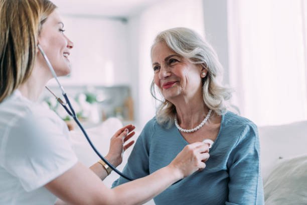 Caregiver supporting medication and well-being checks